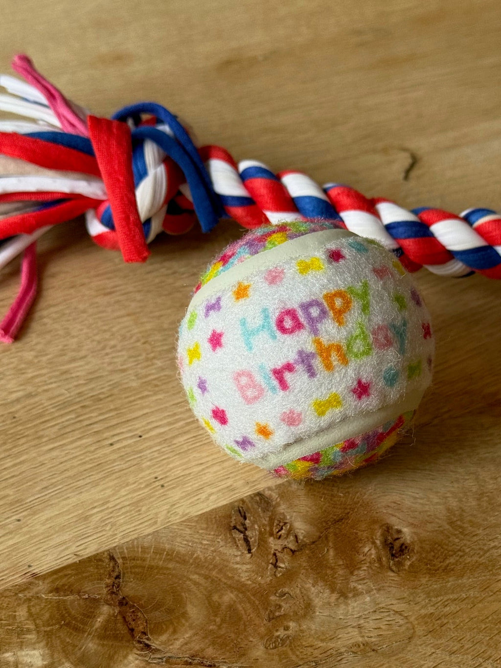 Dog toy with colorful 'Happy Birthday' ball and 100% recycled material rope toy by Pet Gifts by Peggy
