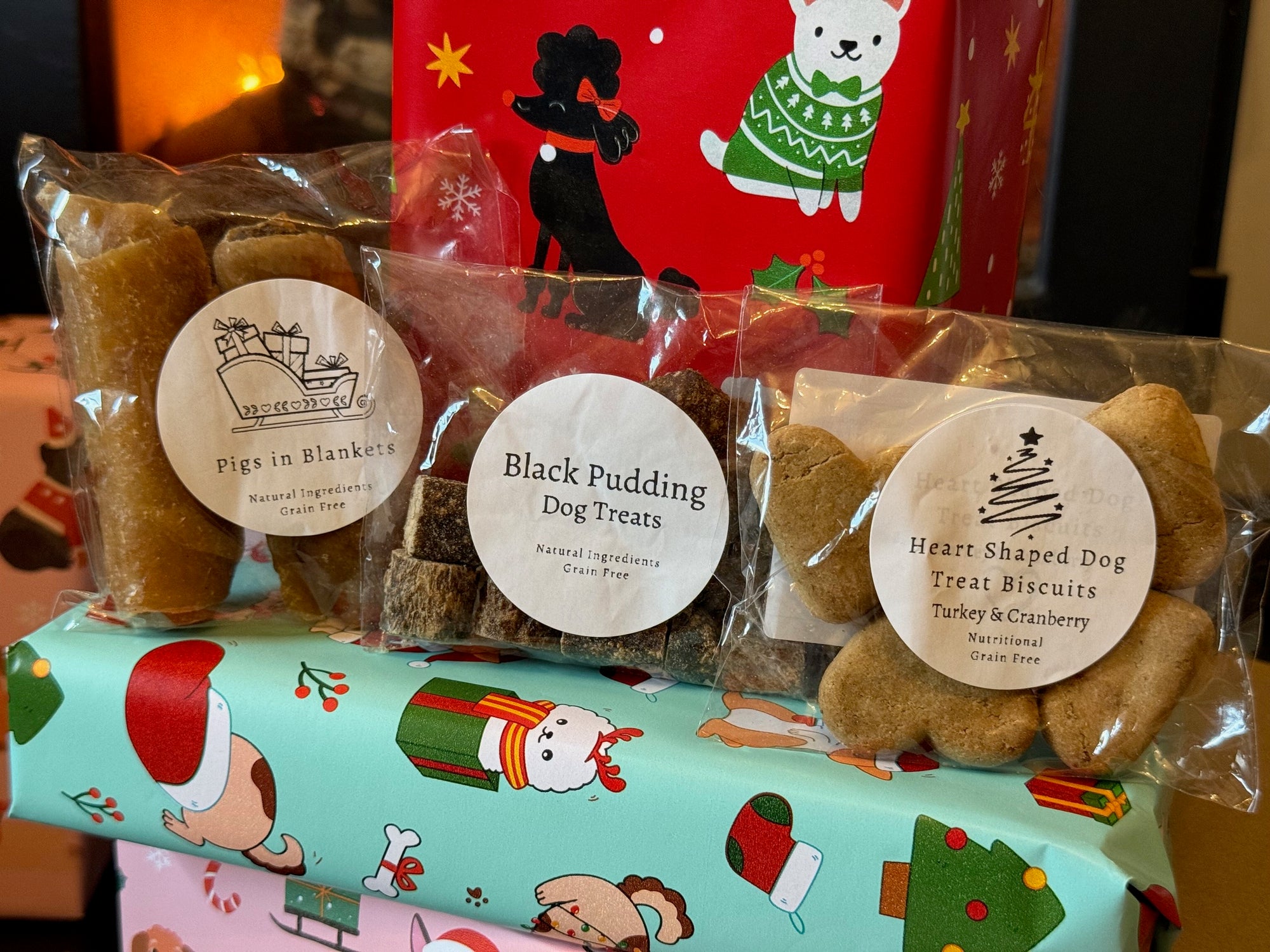 Dog treats in clear packaging with visible branding on a festive background